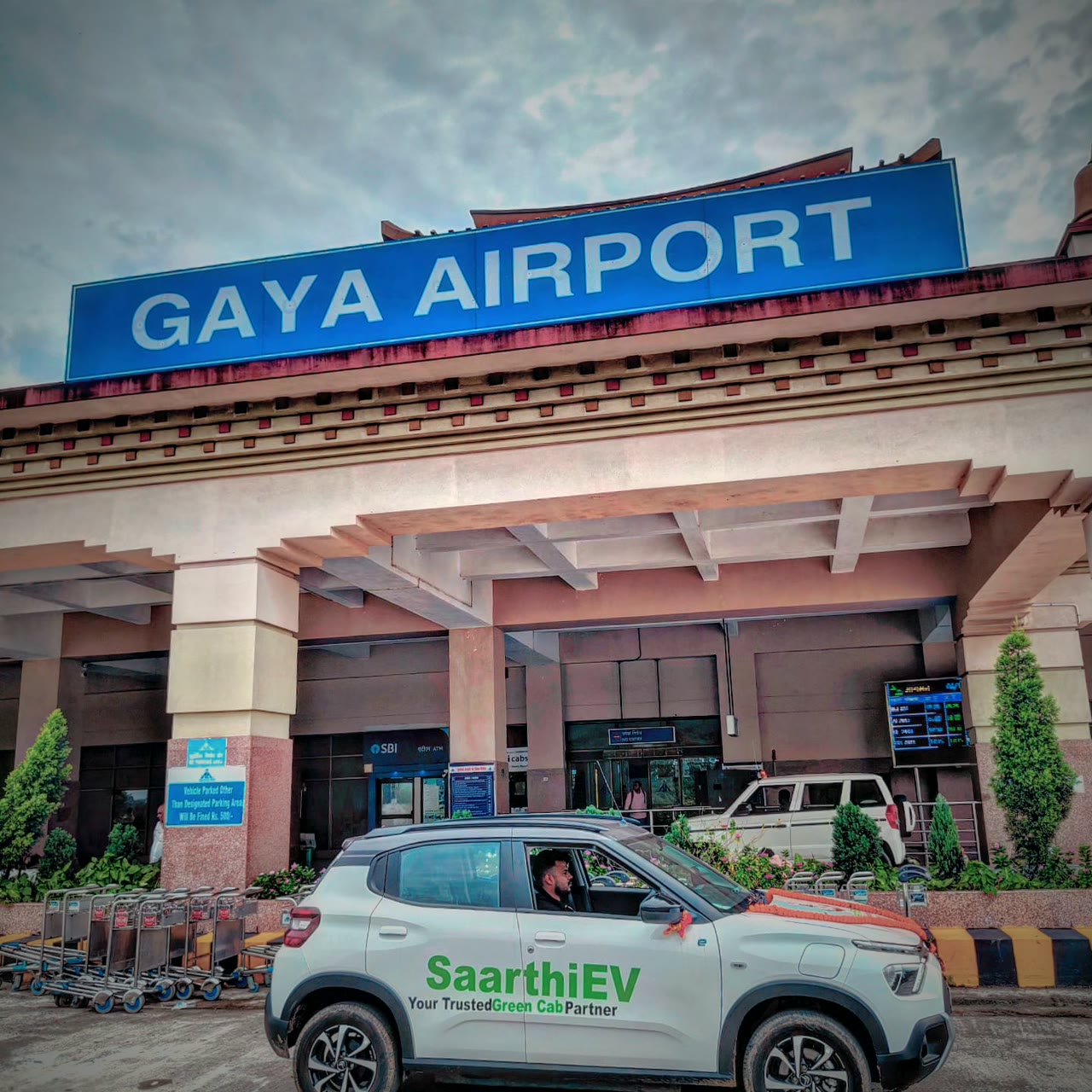 A SaarthiEV cab waiting outside Gaya International Airport