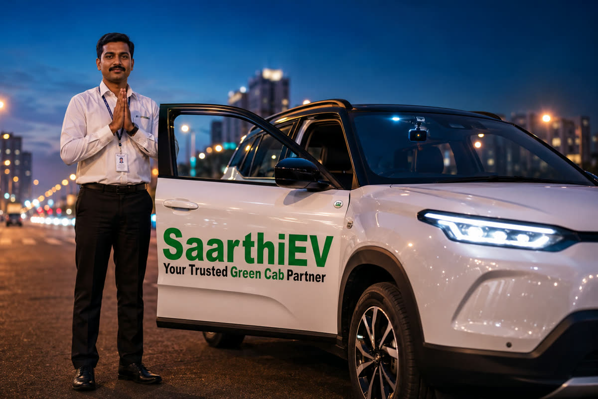 SaarthiEV chauffeur beside a spotless electric cab at night